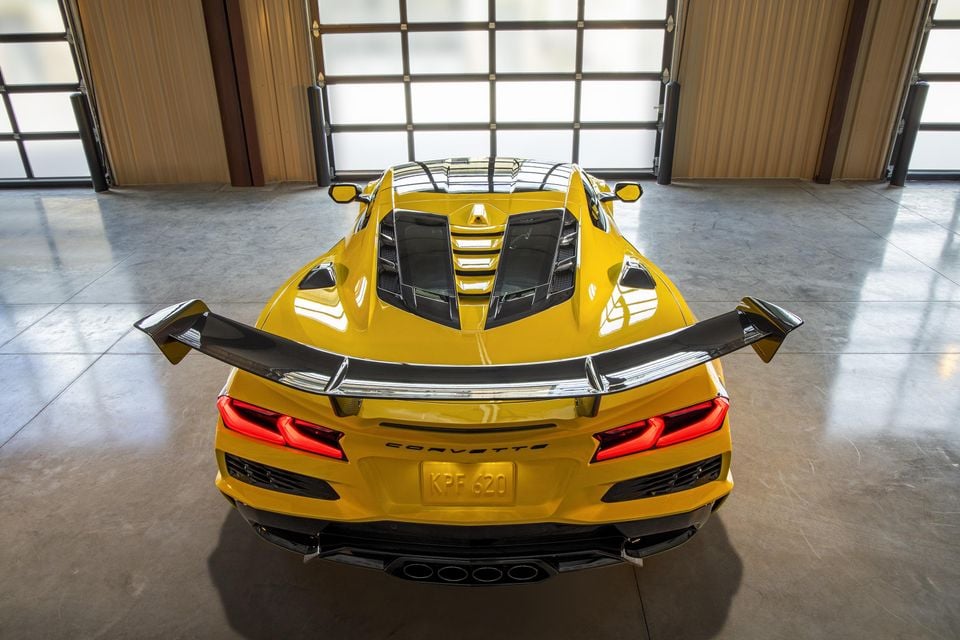 Rear view of Chevrolet Corvette ZR1 Coupe with ZTK Performance Package, highlighting the split-window rear hatch, parked in a garage. Preproduction model shown. Actual production model may vary.