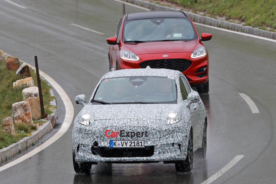 Puma Gen-E prototype ahead of a Kuga