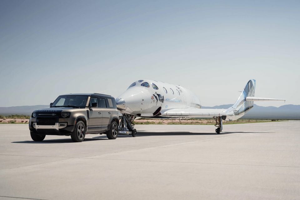 Land Rover Defender 110 towing a Virgin Galactic Spacecraft in 2021