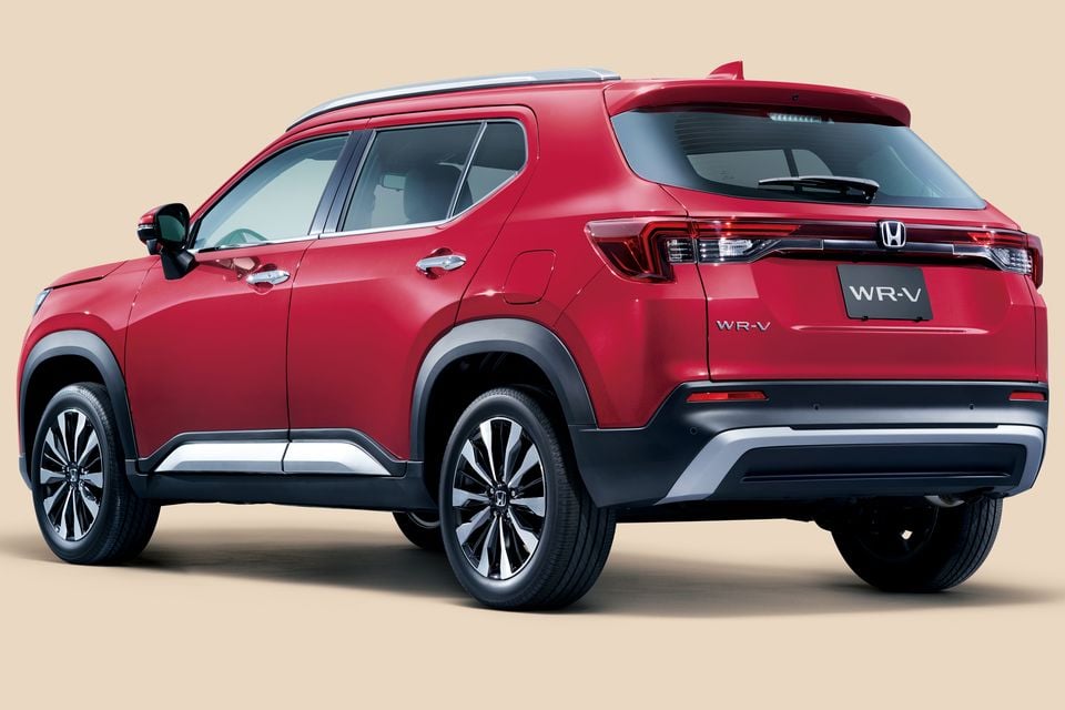 A red 2024 Honda WR-V SUV seen from the rear three-quarter angle against a neutral background