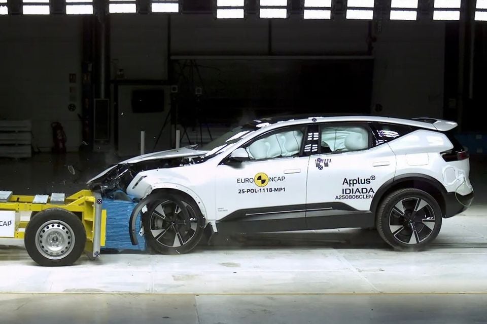 A white 2024 Polestar 3 SUV undergoing a Euro NCAP frontal offset crash test, with front-end damage and airbags deployed.