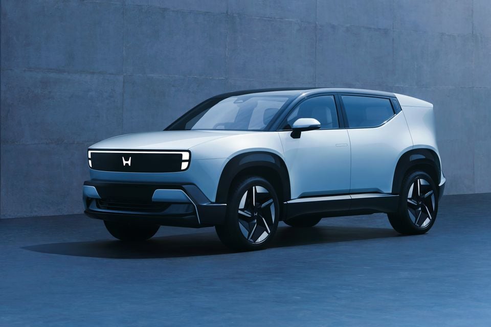 A light blue Honda 0 Series Alpha prototype electric SUV shown from the front quarter angle in a studio setting.