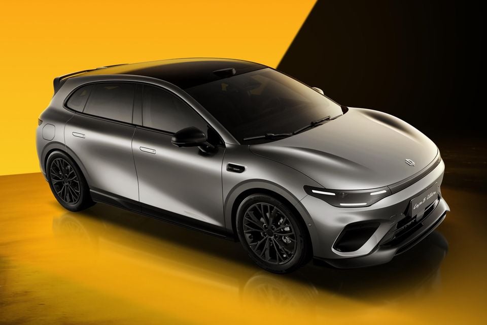 A silver Leapmotor B05 Ultra hatchback seen from a front three-quarter angle against a yellow studio background
