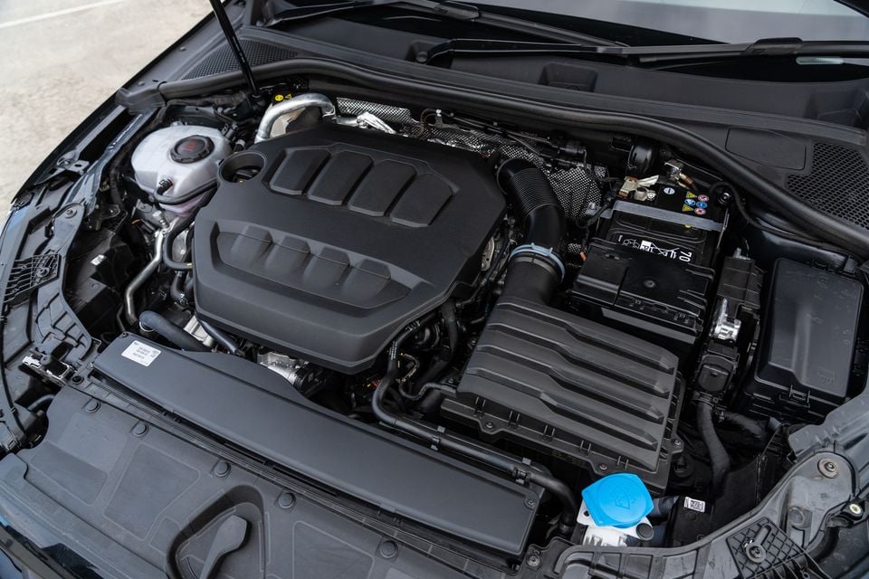 Engine bay of a 2026 Audi A3 sedan with the bonnet open, showing the turbocharged four-cylinder engine and surrounding components