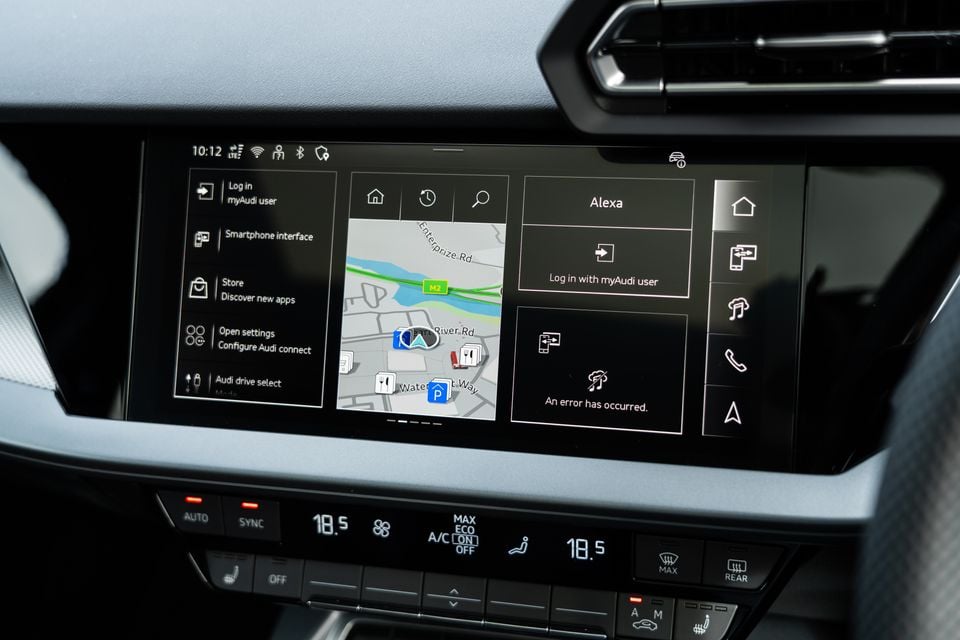 The Audi infotainment touchscreen inside a 2026 Audi A3, showing the navigation map, Alexa integration, myAudi login options, and climate controls below.