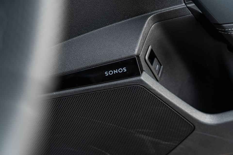 Close-up of a Sonos speaker grille and badge on the door panel interior of a 2026 Audi A3