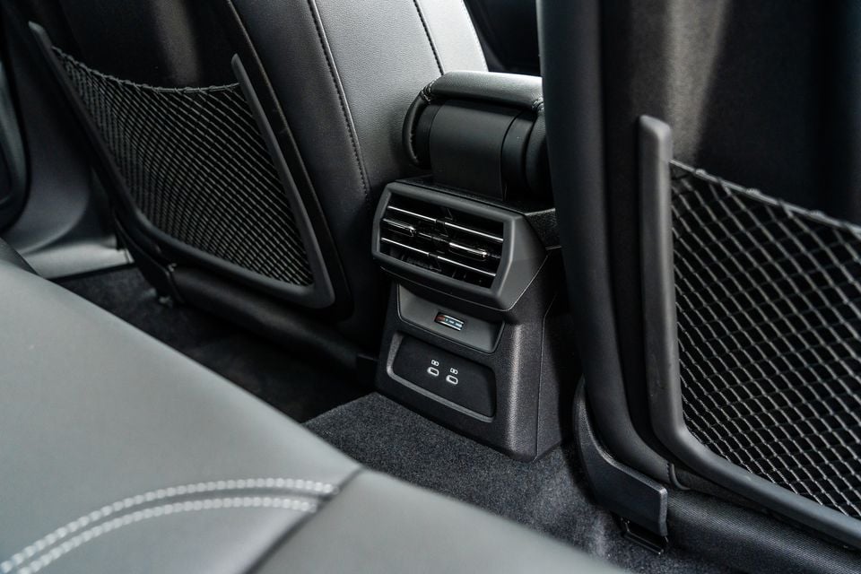 Rear air vents and USB charging ports on the back of the centre console in a 2026 Audi A3 sedan S line interior