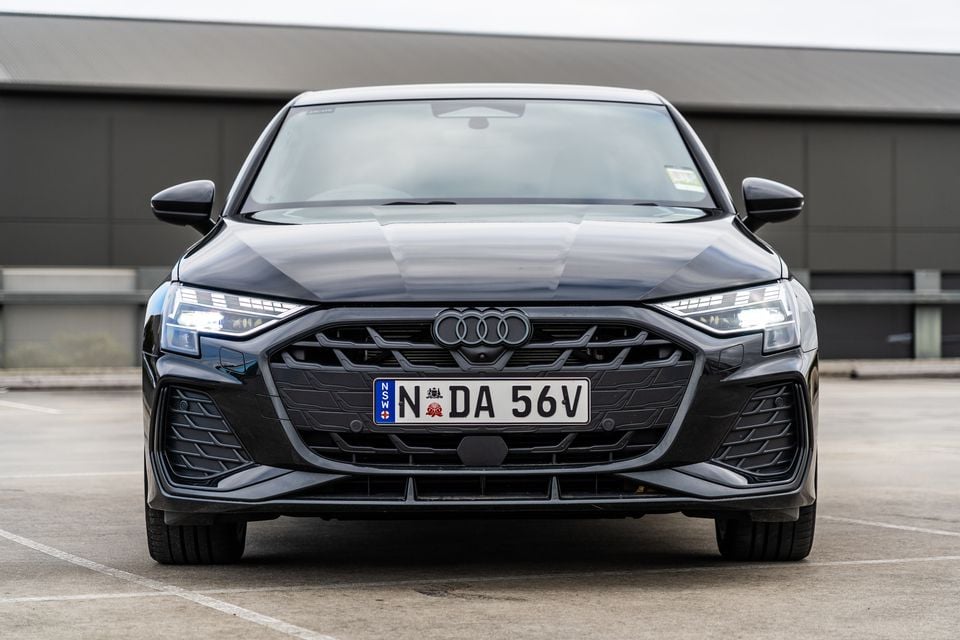 A black 2026 Audi A3 sedan seen from the front, with NSW plates, parked in a car park