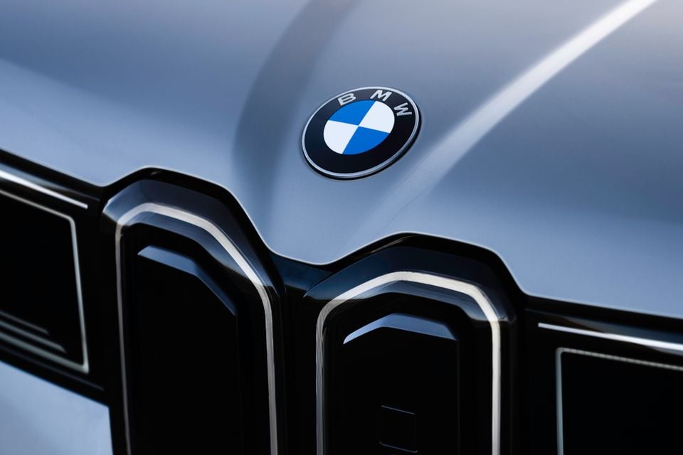 Close-up of the BMW badge and kidney grille on a silver 2026 BMW iX3