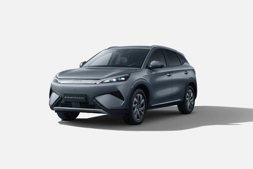 A grey BYD Atto 3 EVO SUV shown from the front three-quarter angle against a white background