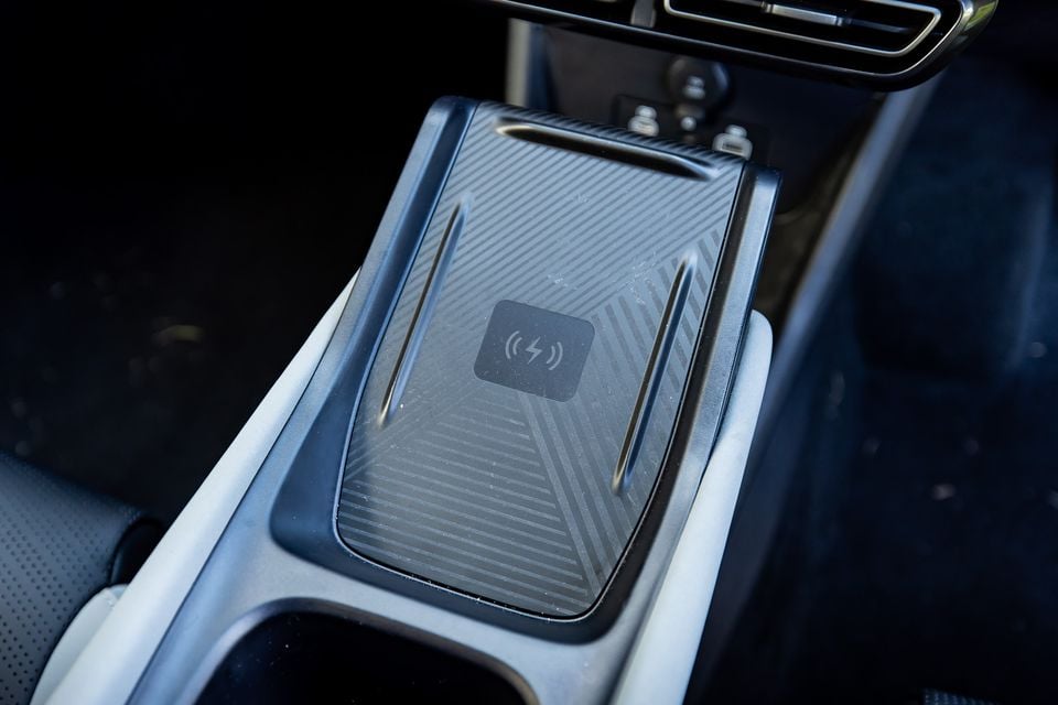Wireless phone charging pad on the centre console of a 2026 BYD Atto 1