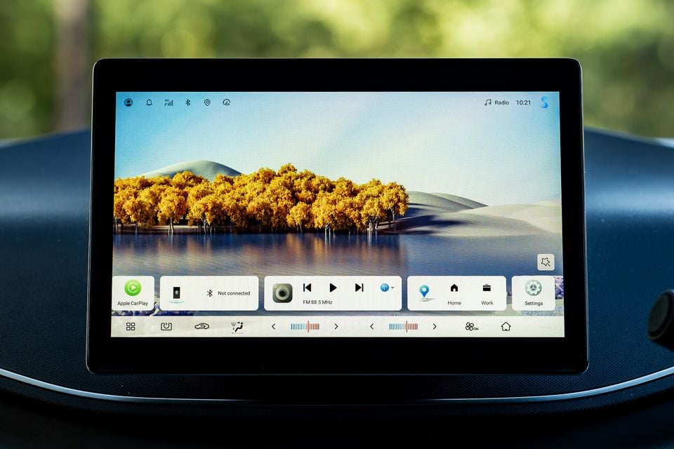 The touchscreen infotainment display of a 2026 BYD Atto 1, showing the home screen with Apple CarPlay, FM radio, and navigation shortcuts