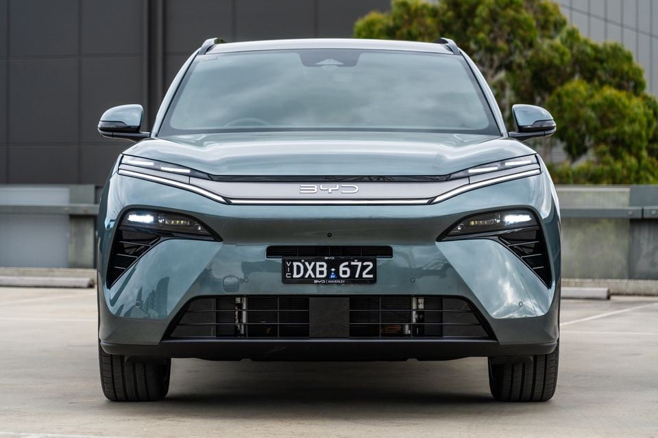 Front view of a teal BYD Sealion 8 SUV with Victorian number plates, parked in an open car park