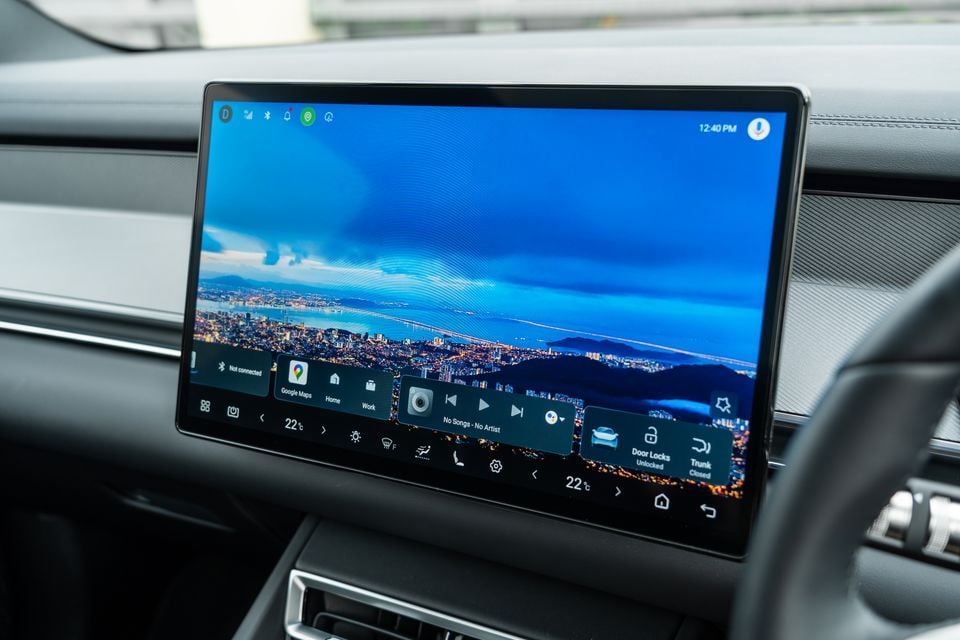 The large touchscreen infotainment display of a 2026 BYD Sealion 8, showing the Android-based home screen with Google Maps, climate controls, and door lock shortcuts