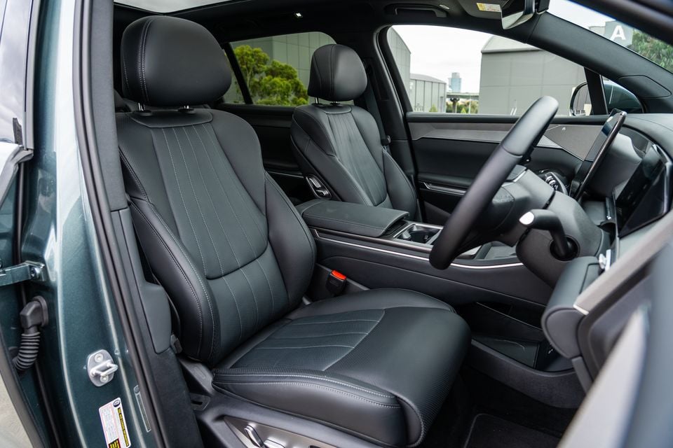 Interior view of the 2026 BYD Sealion 8 Premium AWD showing black leather front seats, centre console, and steering wheel