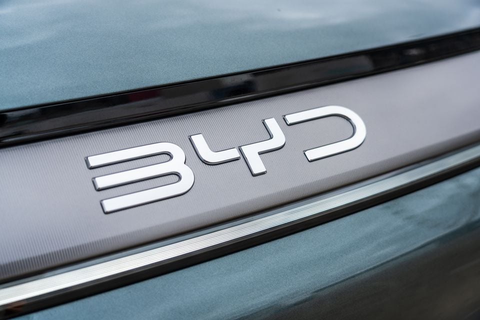 Close-up of the BYD badge on the rear of a blue BYD Sealion 8
