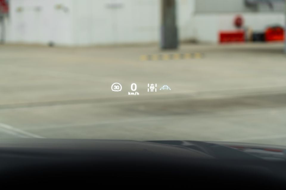 Head-up display in the 2026 BYD Shark 6 showing a 30 km/h speed limit, 0 km/h speed and driver assistance icons, projected onto the windscreen