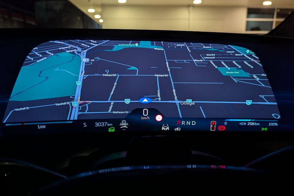 Digital instrument cluster display in the 2026 Cadillac VISTIQ Platinum showing Google Maps navigation, speed, range, and vehicle status information