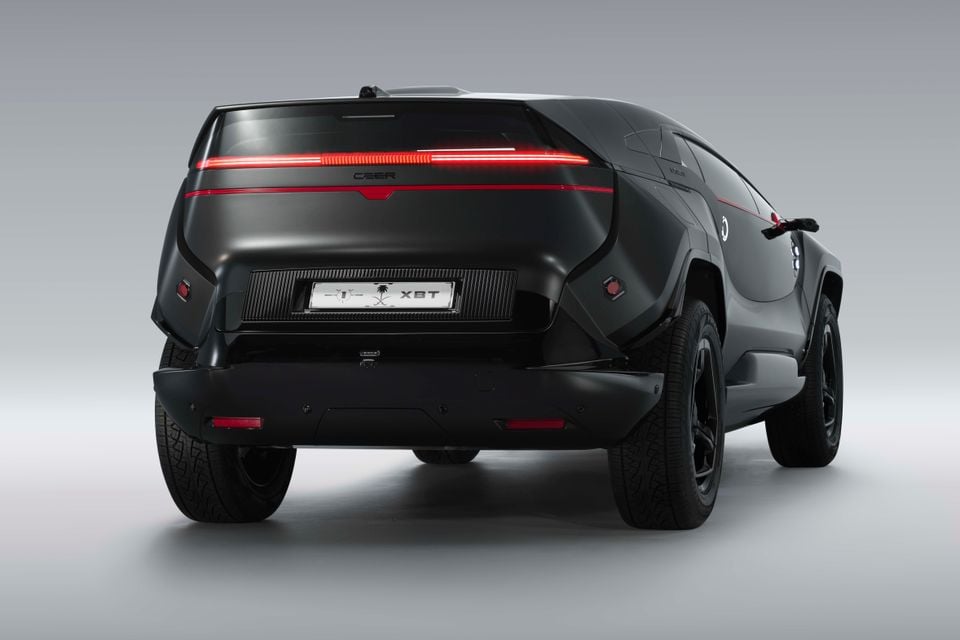 A black 2026 Ceer Exobot concept SUV shown from the rear at an angle in a studio setting