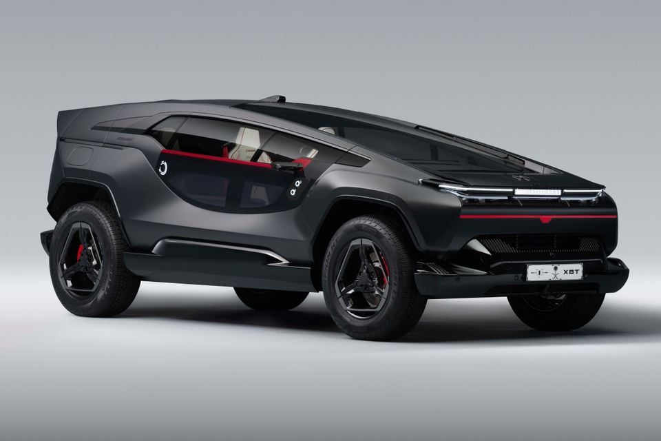 A black Ceer Exobot concept SUV shown from a rear three-quarter angle with a red accent stripe and studio backdrop.