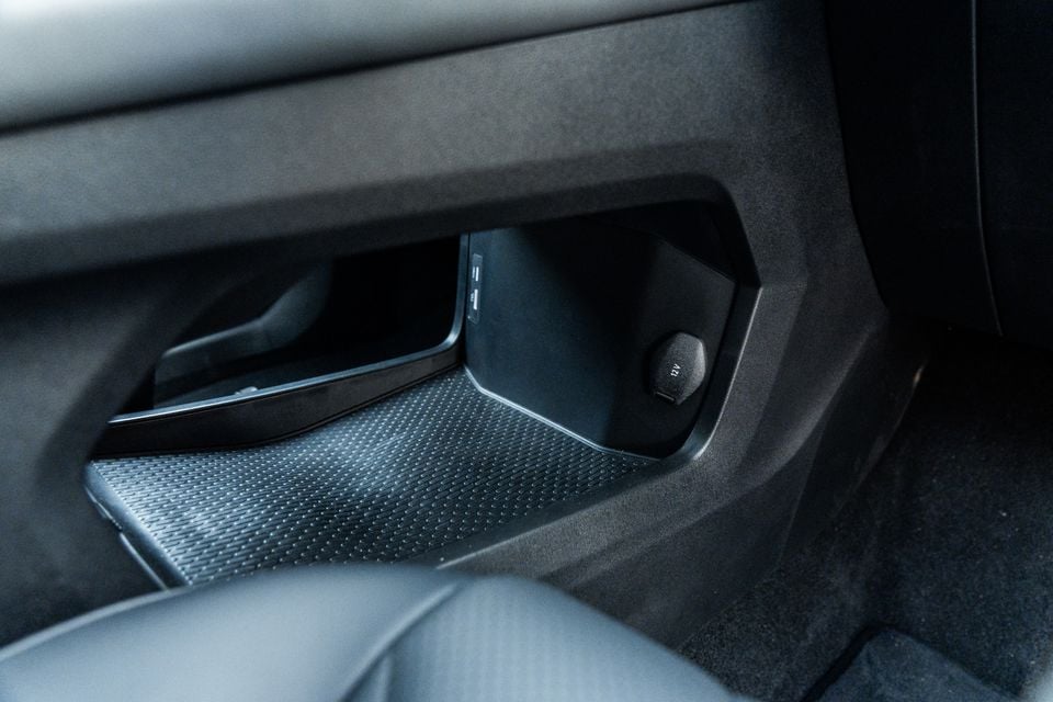 Rear centre console storage area of a 2026 Chery Tiggo 9, showing USB ports and a 12V power outlet