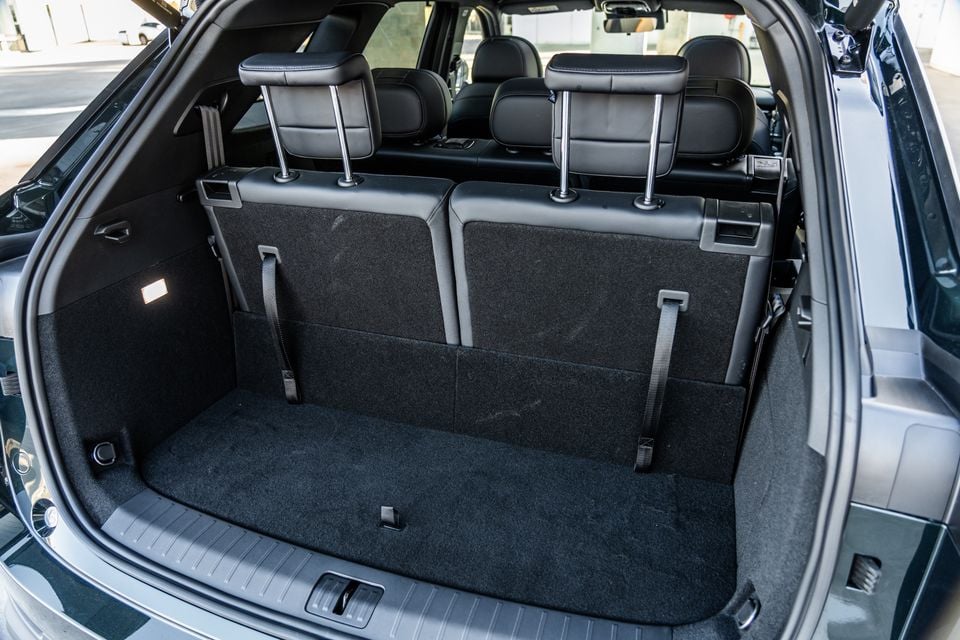 Boot interior of a 2026 Chery Tiggo 9 SUV showing a carpeted load area with rear seatbacks and headrests visible