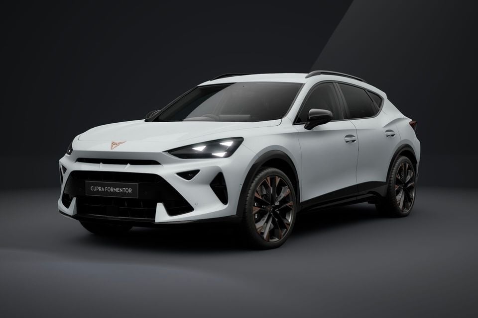 A white 2026 Cupra Formentor SUV shown from the front three-quarter angle in a studio setting
