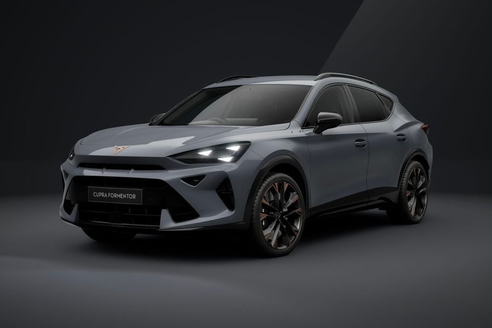 A grey 2026 Cupra Formentor SUV photographed from the front three-quarter angle in a studio setting