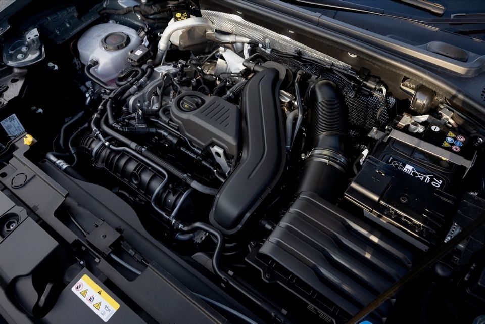 Engine bay of a 2026 Cupra Formentor S showing the petrol engine, air intake, and battery