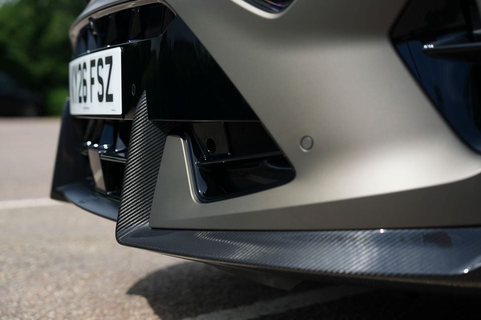 Close-up of the carbon fibre front splitter and lower bumper detail on a 2026 Cupra Formentor VZ5