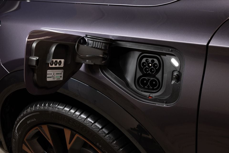 Close-up of the open charging port on a purple 2026 CUPRA Formentor VZe PHEV, showing a CCS combo plug socket on the side of the vehicle