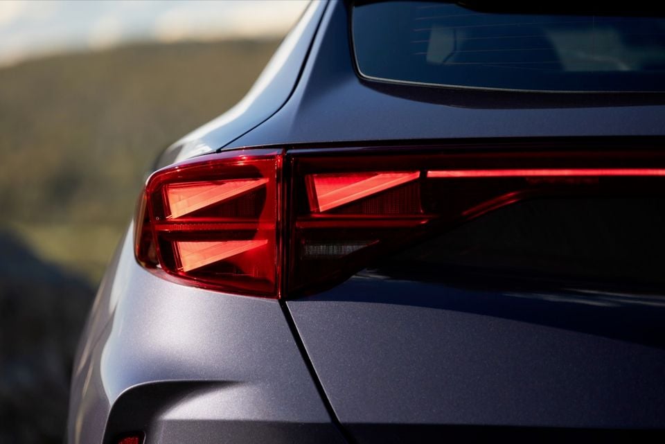 Close-up of the rear tail light on a grey 2026 Cupra Formentor VZe PHEV, showing angular red LED light design