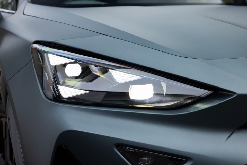 Close-up of the illuminated LED headlight on a grey 2026 CUPRA Formentor VZX