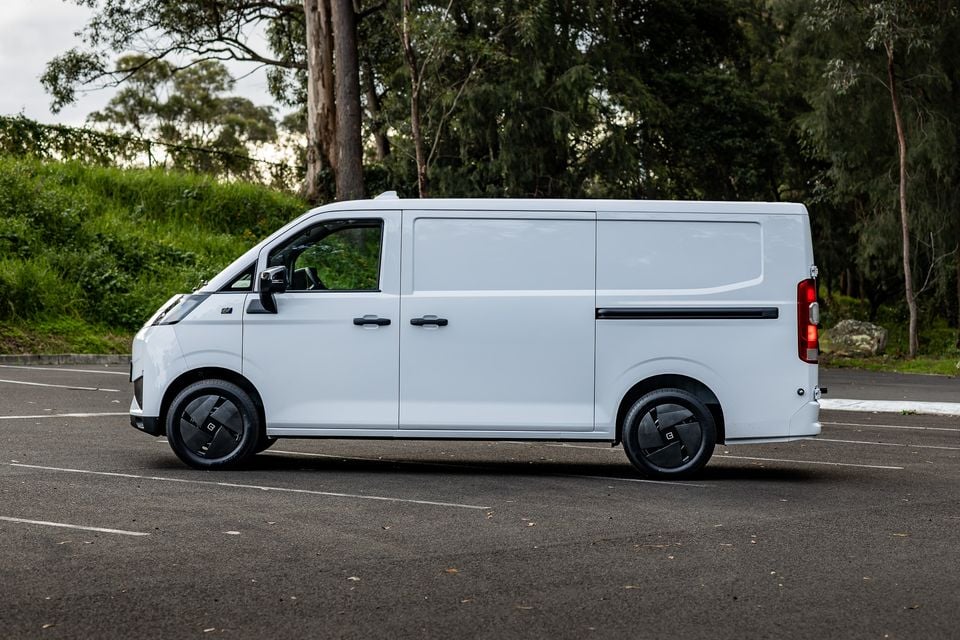 A white 2026 Farizon V7E panel van seen from the side, parked in a car park with trees in the background