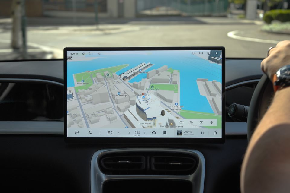 A 3D navigation map displayed on the large central touchscreen of a Geely EX2, showing a Sydney waterfront area including Jones Bay Wharf and Star City Light Rail Station