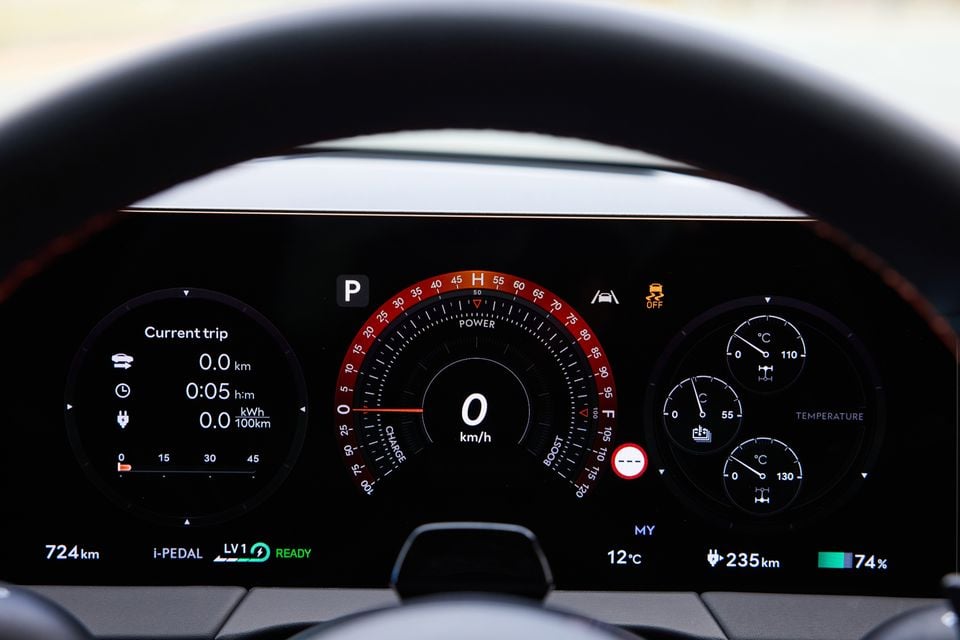 Digital instrument cluster of the 2026 Genesis GV60 Magma showing a speedometer, power gauge, trip data, 235km remaining range, and 74% battery charge