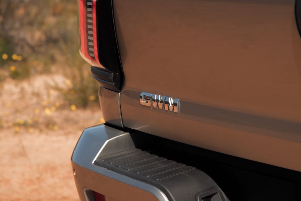 Close-up of the GWM badge on the rear tailgate of a bronze 2026 GWM Cannon Alpha ute