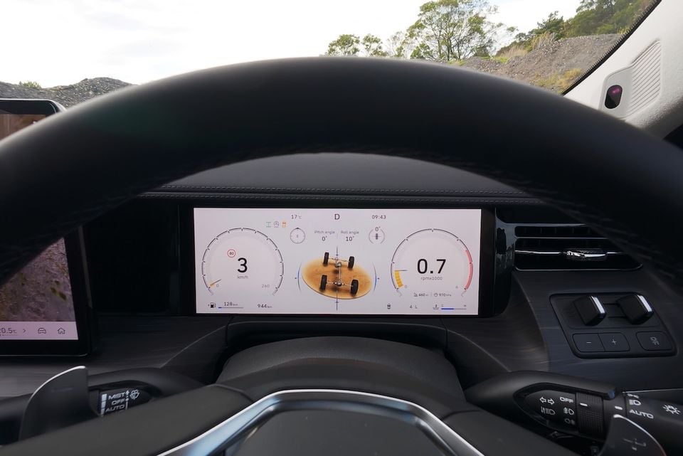 The digital instrument cluster of a 2026 GWM Cannon Alpha shows an off-road display with pitch and roll angles, speed, and wheel articulation view.