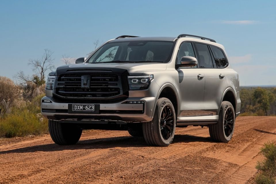 A silver 2026 GWM Tank 500 SUV parked on a dirt road, viewed from the front quarter.
