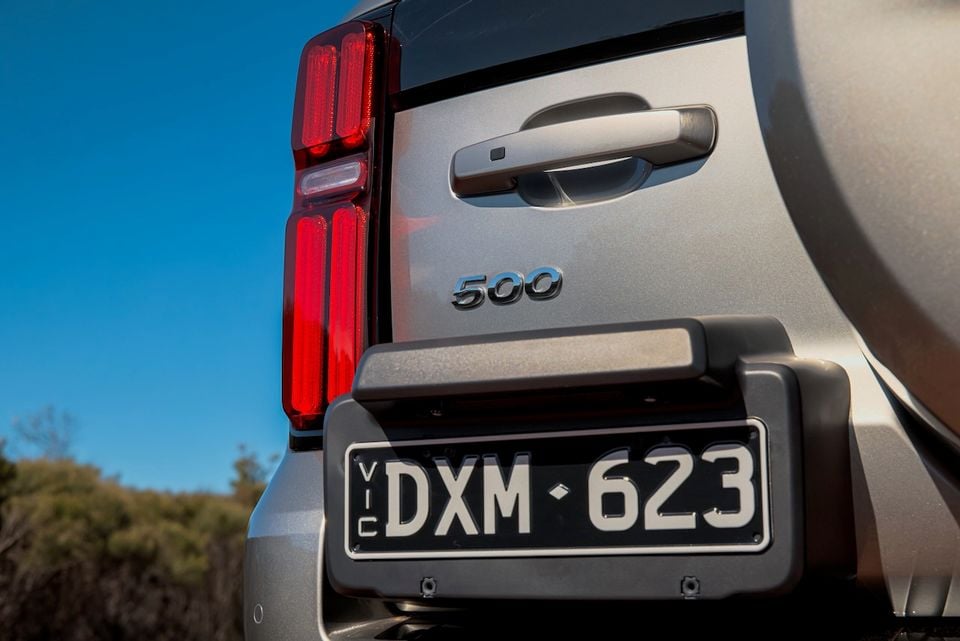 Close-up of the rear taillight, badge and number plate on a silver 2026 GWM Tank 500 SUV.