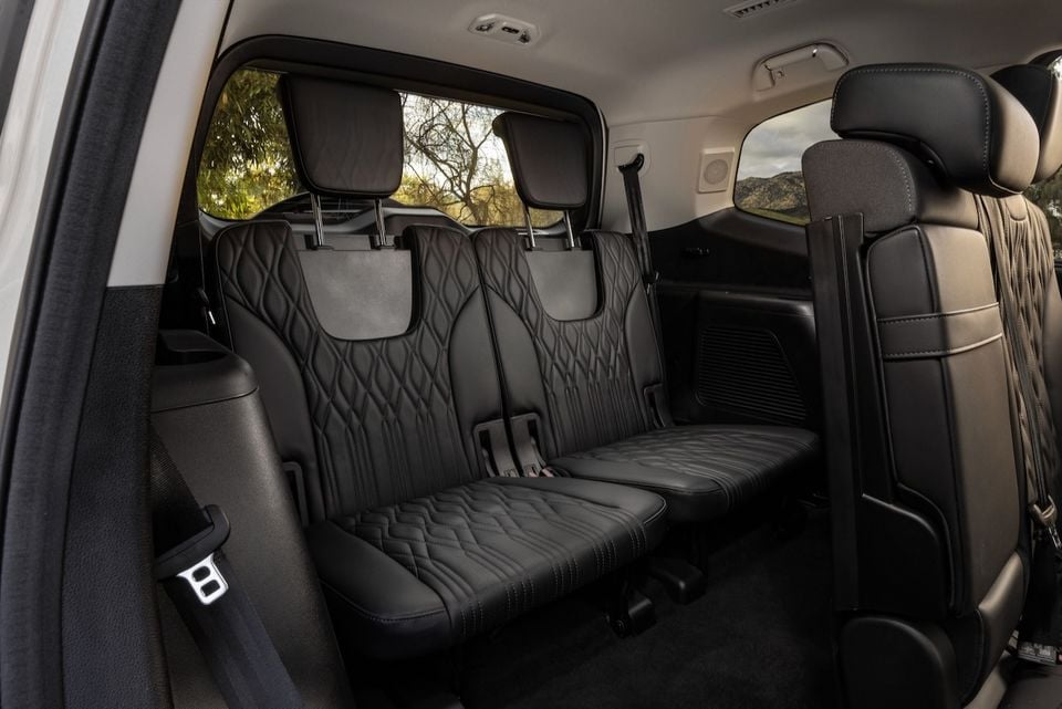 The black leather third-row seats of a 2026 GWM Tank 500 SUV, viewed through the open rear door.