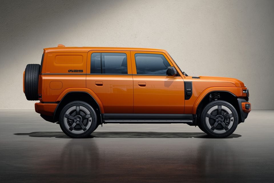 Side view of an orange iCaur V25 SUV with a tailgate-mounted spare wheel