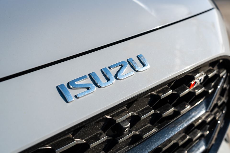 Close-up of the Isuzu badge and front grille on a 2026 Isuzu MU-X X-Terrain