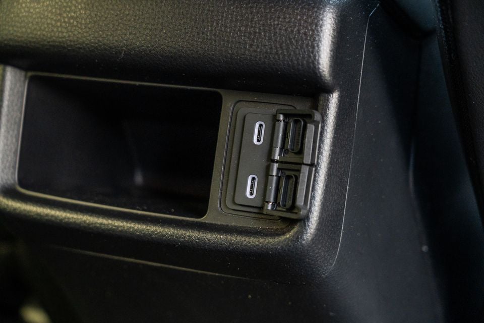 USB-C charging ports and additional outlets on the rear interior panel of a 2026 Isuzu MU-X X-Terrain