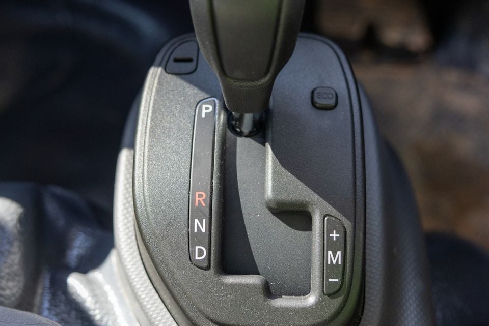Close-up of a vehicle's automatic gear shifter showing the PRND selector and manual mode controls, likely from a 2026 Isuzu truck