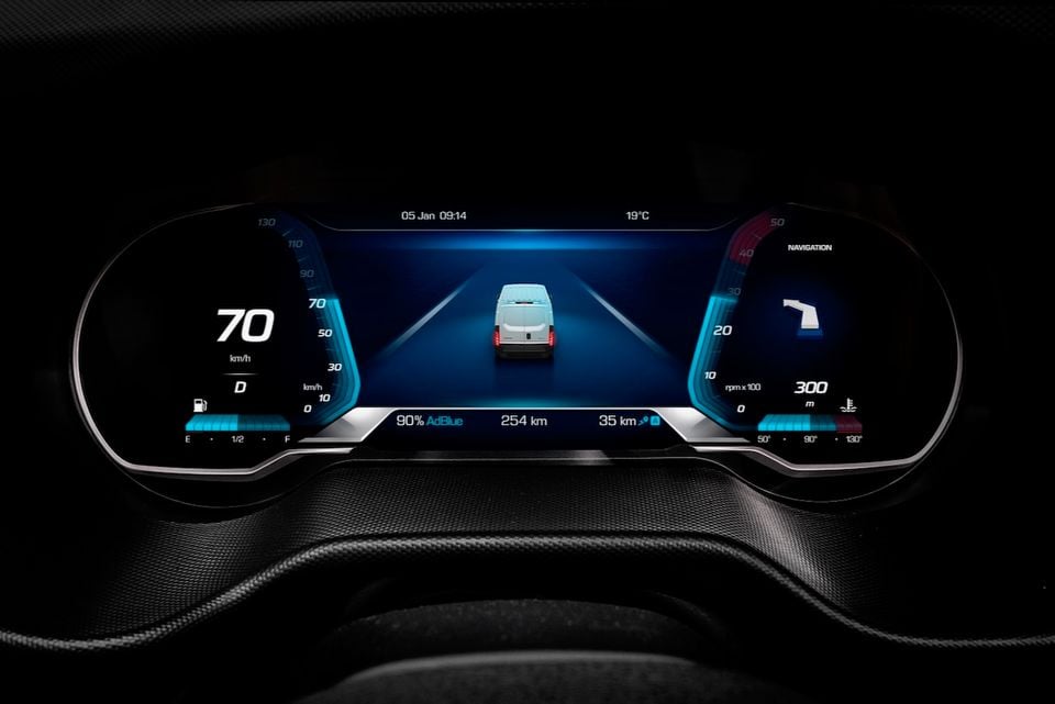 Digital instrument cluster of a 2026 Iveco Daily van showing speedometer, navigation, AdBlue level, and a graphic of a van on a road