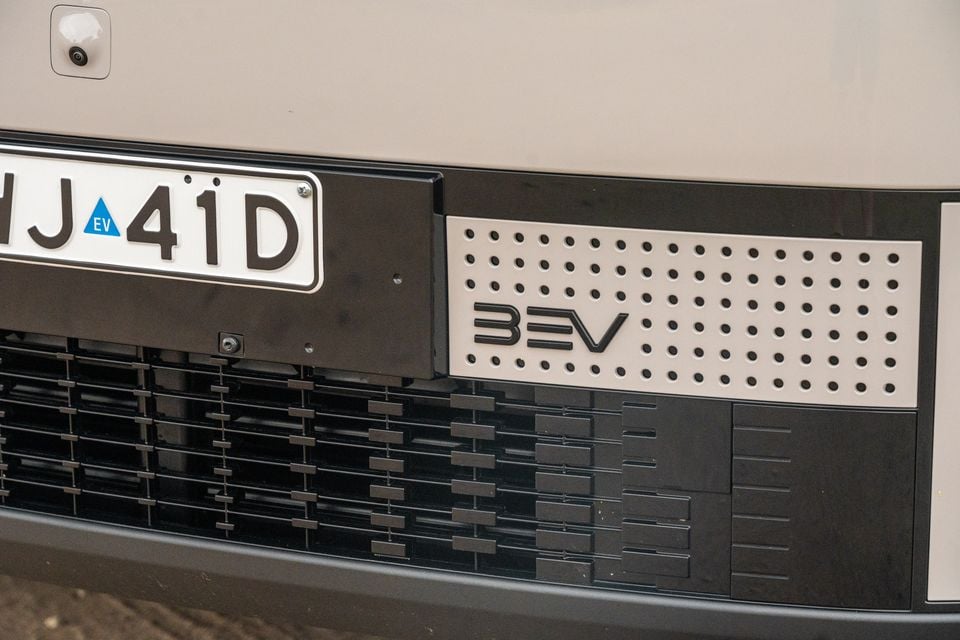 Close-up of the front bumper and lower grille area of a 2026 Jaecoo J5 EV, showing a 'BEV' badge and an Australian EV number plate
