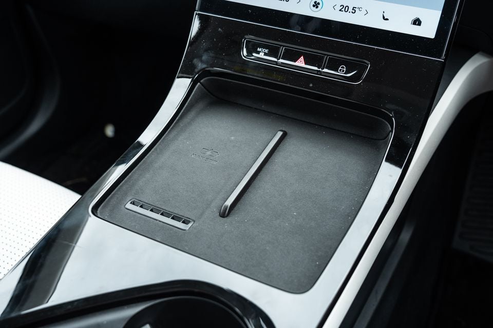 Wireless charging pad and centre console of the 2026 Jaecoo J5 EV, with climate control buttons and touchscreen visible above
