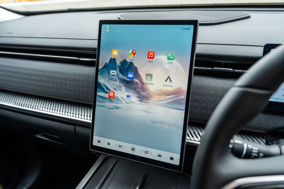 The large portrait-orientation touchscreen infotainment display in a 2026 Jaecoo J7, showing the home screen with apps including Navigation, Media, Apple CarPlay, and Android Auto