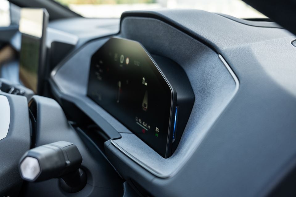 Close-up of the digital instrument cluster in the 2026 Lexus ES350e, showing a colourful driver display screen set into a hooded dashboard surround